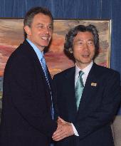 Blair urges Koizumi to keep up structural reforms